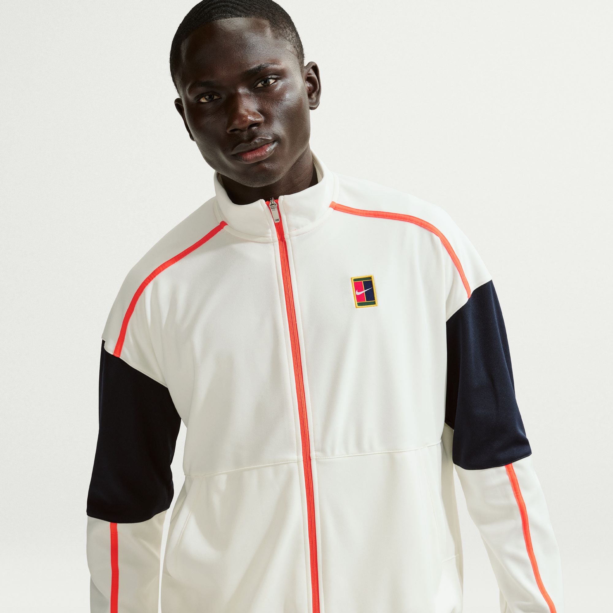 Nike Men's Court Heritage Tennis Jacket in Sail/Turf Orange