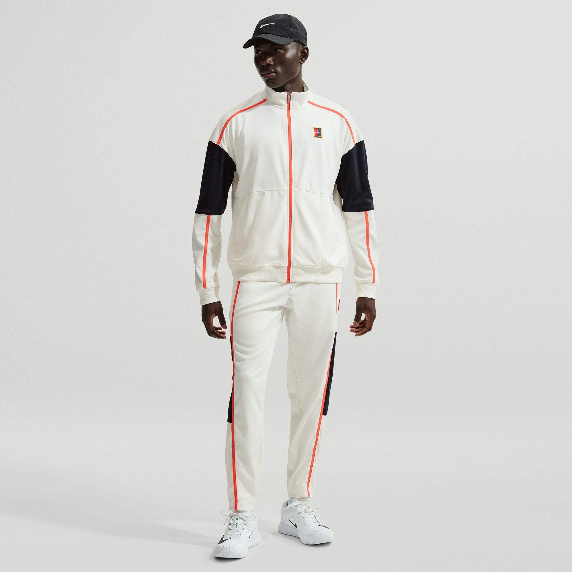 Nike Men's Court Heritage Tennis Jacket in Sail/Turf Orange