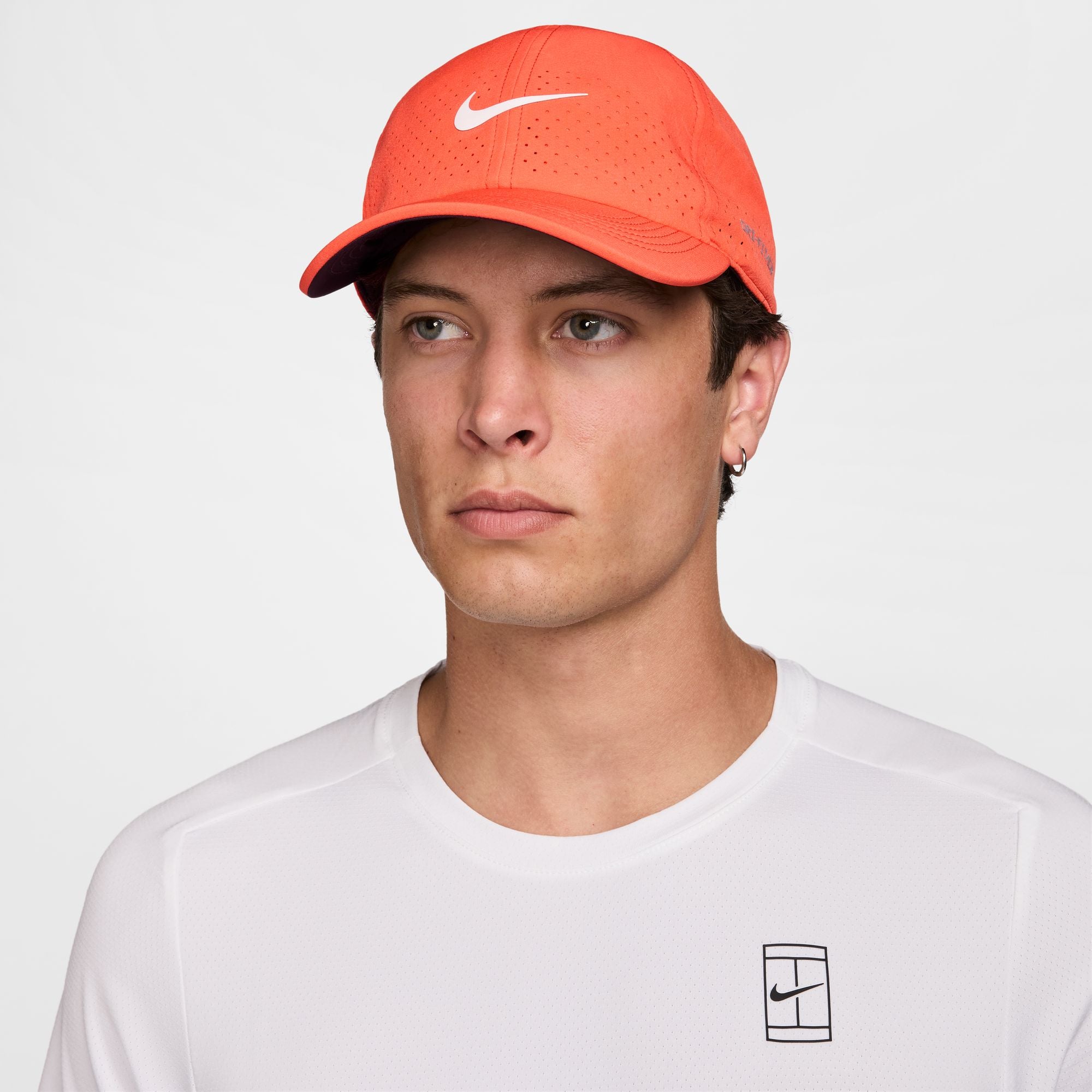 Nike Dri-FIT ADV Club Unstructured Tennis Cap in Turf Orange/White