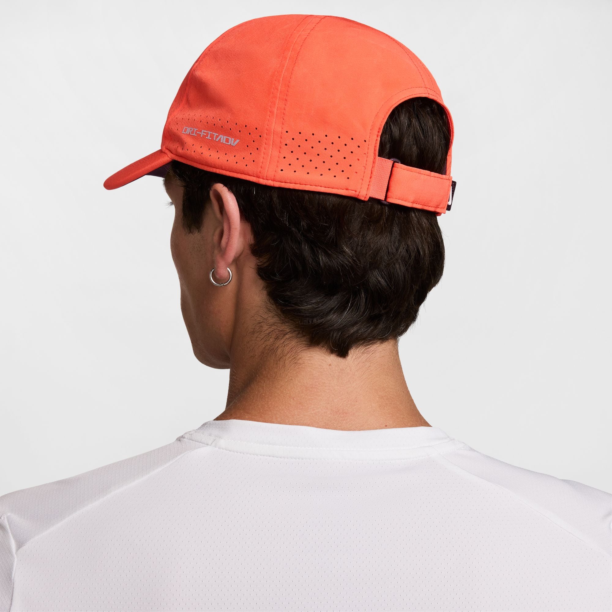 Nike Dri-FIT ADV Club Unstructured Tennis Cap in Turf Orange/White